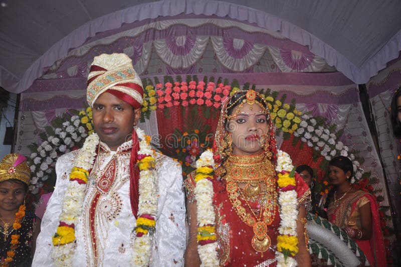 A skih bride & groom pose for formal wedding photos just after their wedding  ceremony at a temple in Queens, New York Stock Photo - Alamy