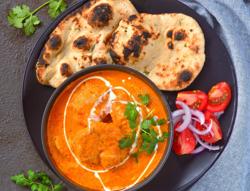 Indian Meal -Butter Chicken with roti and salad royalty free stock photo Indian Meal -Butter Chicken with roti and salad royalty free stock photo