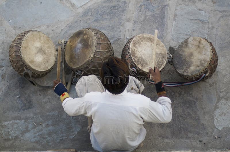 Leh, Ladakh, India, musician playing traditional Dholak drums royalty free stock image Leh, Ladakh, India, musician playing traditional Dholak drums royalty free stock image