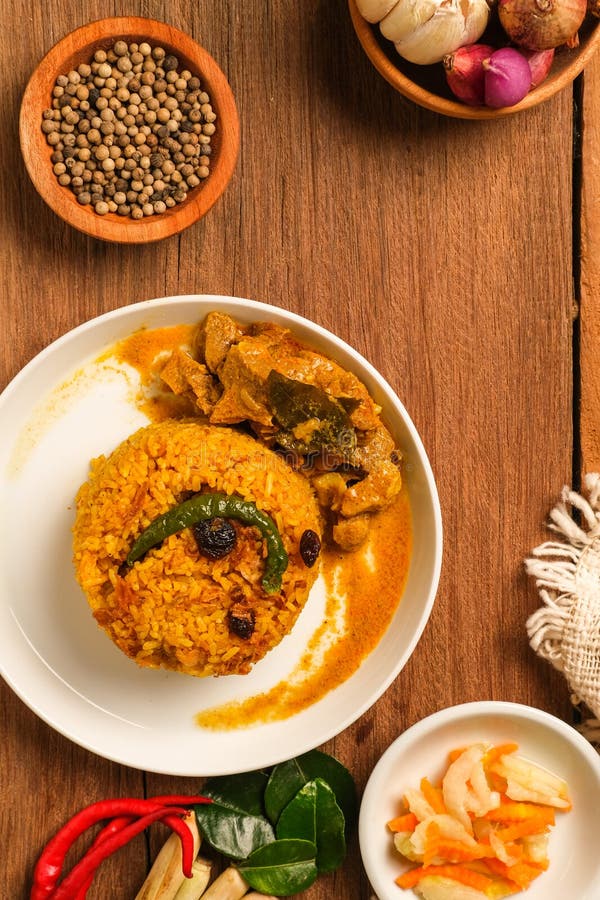 Indian Mutton Biryani Dish Served on Wooden Table Stock Photo - Image