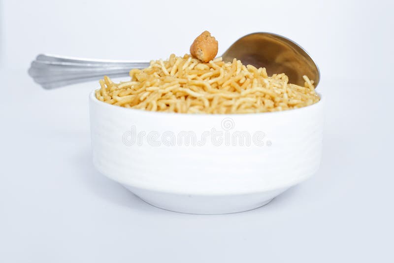 Indian namkeen snacks bikaneri bhujia with spoon in the bowl stock images Indian namkeen snacks bikaneri bhujia with spoon in the bowl stock images