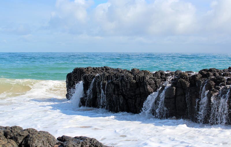 Indian Ocean waves dumping against dark basalt rocks on Ocean Beach Bunbury Western Australia royalty free stock image Indian Ocean waves dumping against dark basalt rocks on Ocean Beach Bunbury Western Australia royalty free stock image