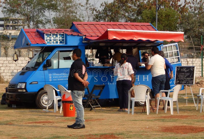 Indian People Buy Street Food at Food Trucks Stationed in Open Area