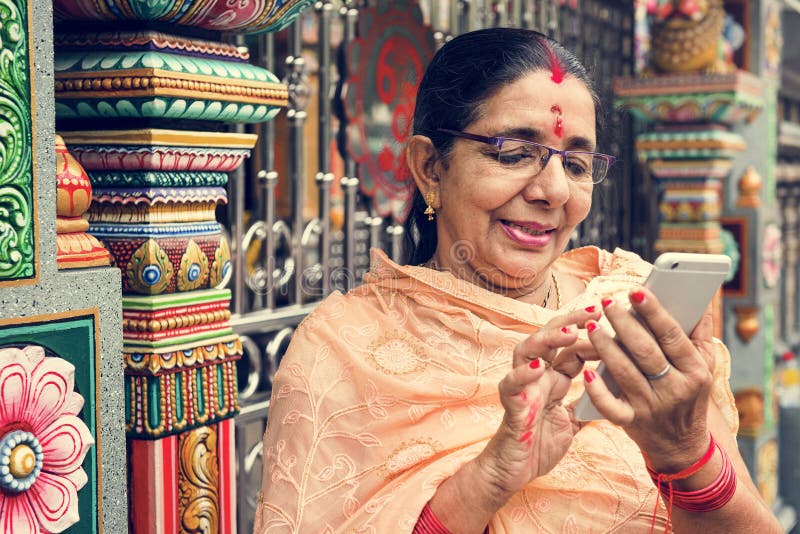 Indian senior woman using mobile phone stock photography Indian senior woman using mobile phone stock photography