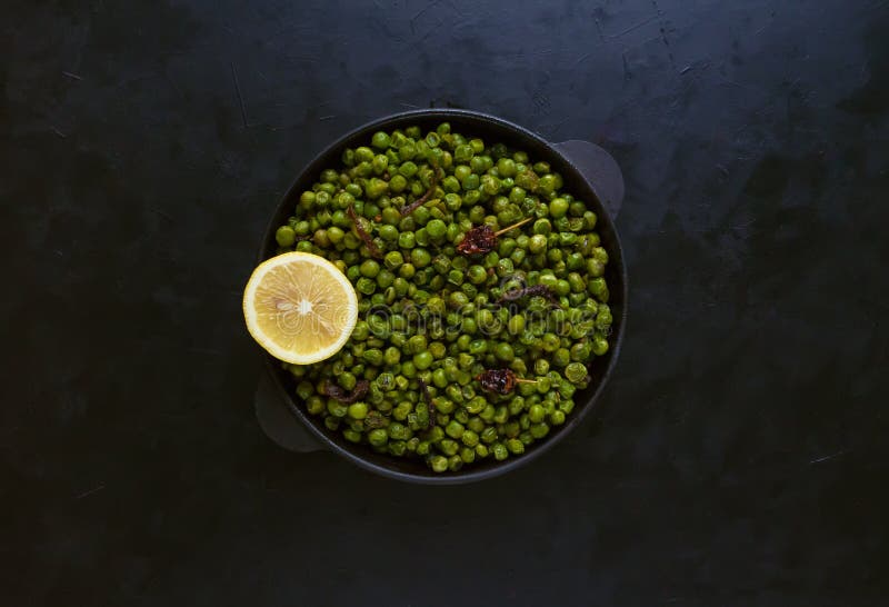 Indian Spiced Peas. Traditional Indian garnish of fried green peas with spices.