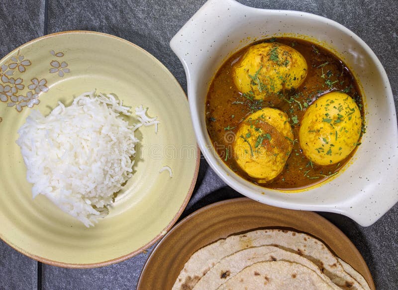 An Indian Spread of Spicy Egg Curry or Egg Masala in a Bowl Stock Image