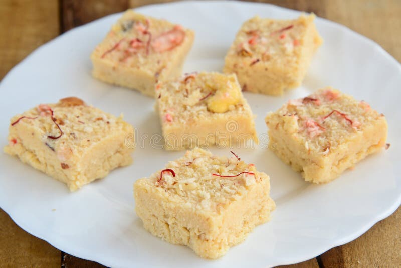 Coconut barfi:An indian sweet made from Coconut and color added to it. This is from the streets of Hyderabad. Coconut barfi:An indian sweet made from Coconut and color added to it. This is from the streets of Hyderabad.