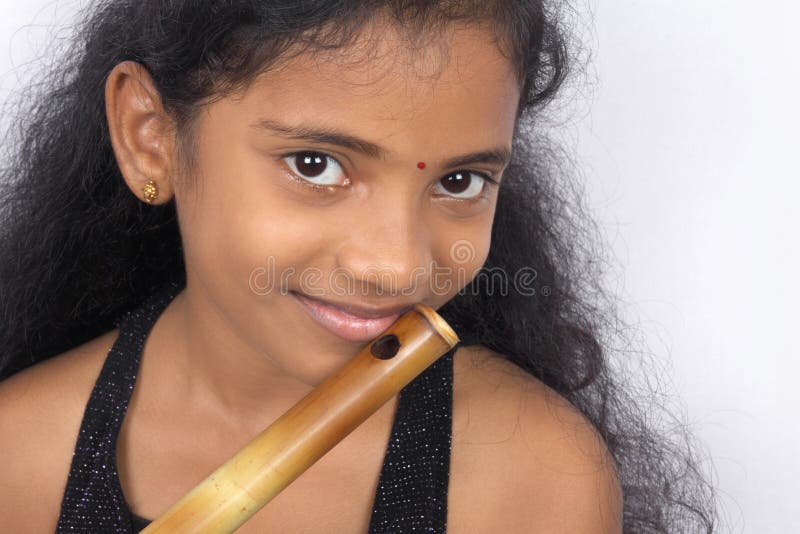 Indian Teenage Girl With Flute