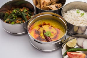 Indian Lunch Box Or Tiffin Spicy Ladies Finger Dal Fry Rice And Indian Lunch Box Or Tiffin Spicy Ladies Finger Dal Fry Rice And