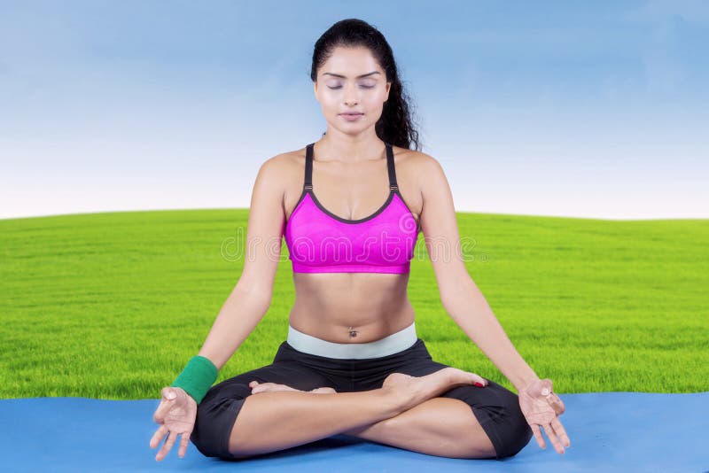 Indian woman meditating at field royalty free stock images Indian woman meditating at field royalty free stock images