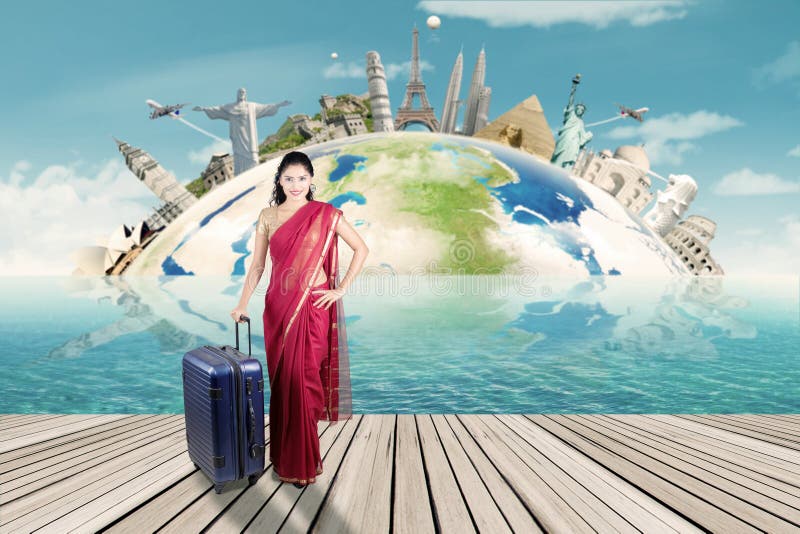 Indian woman with suitcase and map of world monument royalty free stock photography Indian woman with suitcase and map of world monument royalty free stock photography