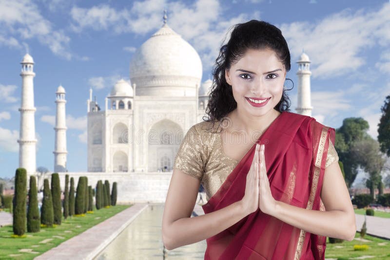 Indian woman with welcome gesture in Taj Mahal royalty free stock photography Indian woman with welcome gesture in Taj Mahal royalty free stock photography