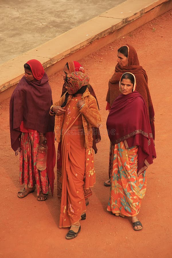 Indian women in colorful sari standing in courtyard of Safdarjung Tomb, New Delh