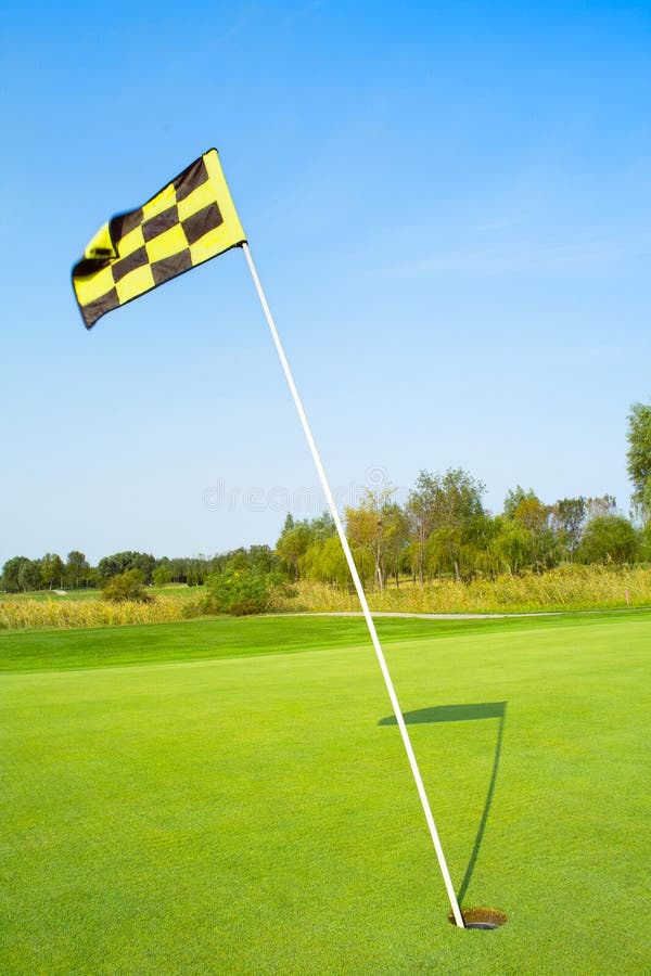 Golf flag in the morning. Golf flag in the morning