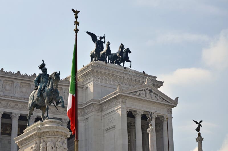 Flag on Victor Emanuel monument and equestrian group in the historical center of Rome. Flag on Victor Emanuel monument and equestrian group in the historical center of Rome