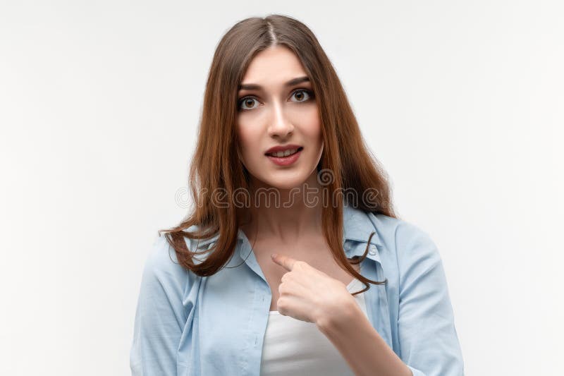 Indignant Brunette Female Points At Herself With For Finger Has