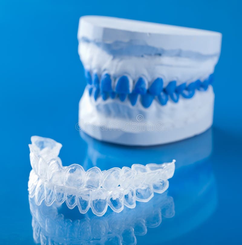 Individual tooth tray for whitening over blue