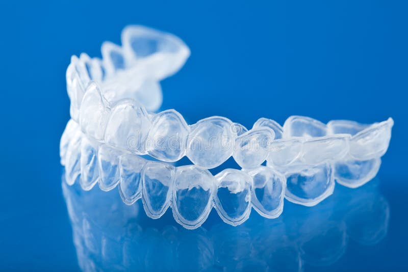 Individual tooth tray for whitening over blue