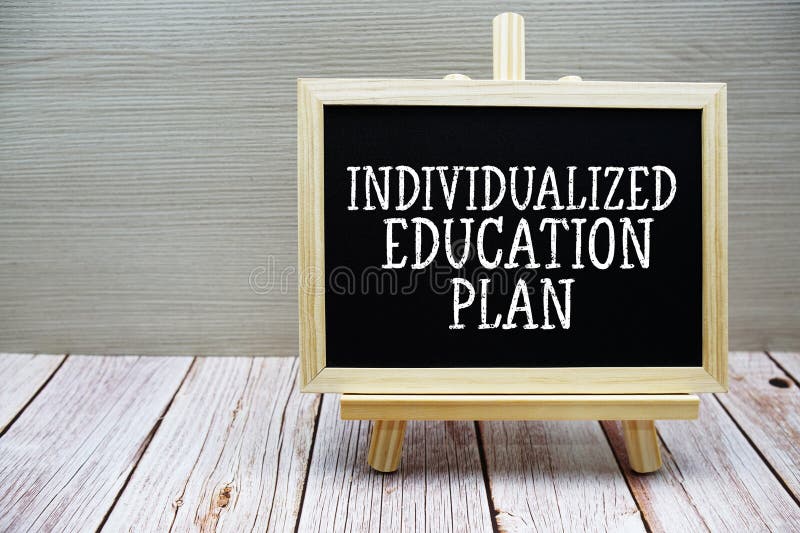 Individualized Education Plan text written on chalkboard with easel on wooden background stock photography