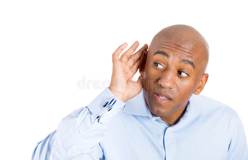 Closeup portrait of handsome guy with blue shirt trying to secretly listen in on a conversation and shocked at what he hears, privacy violation, isolated on white background with copy space. Closeup portrait of handsome guy with blue shirt trying to secretly listen in on a conversation and shocked at what he hears, privacy violation, isolated on white background with copy space