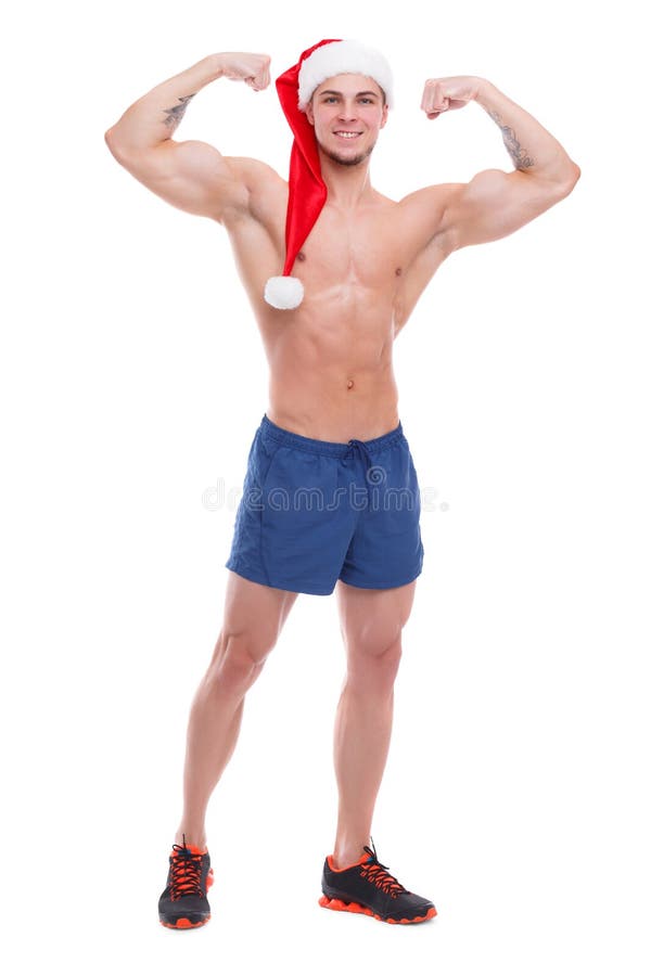 Indivíduo atlético considerável com torso despido e o chapéu de Santa que levantam mostrando o bíceps Isolado foto de stock royalty free Indivíduo atlético considerável com torso despido e o chapéu de Santa que levantam mostrando o bíceps Isolado foto de stock royalty free