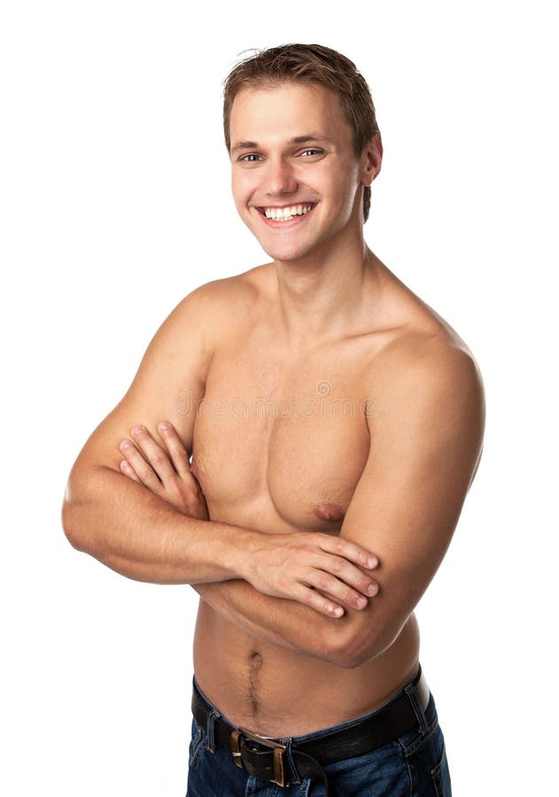 Indivíduo novo de sorriso bonito nas calças de brim com torso desencapado fotos de stock Indivíduo novo de sorriso bonito nas calças de brim com torso desencapado fotos de stock