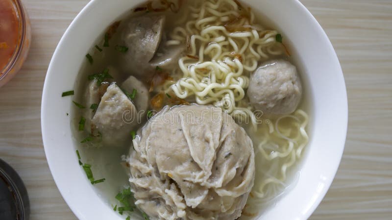 Indonesian famous foodstreet Bakso or baso is a meatballs served with the soup if beef broth, noodle, additional soy sauce and some chilli sauce.