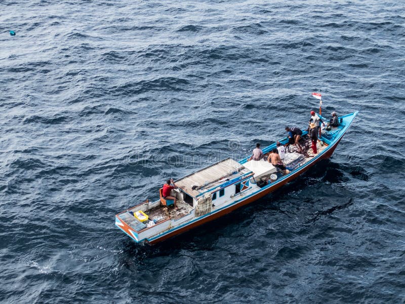 Borneo, Indonesia - 2015: Indonesian fisherman fishing offshore of Balikpapan city on Borneo Island