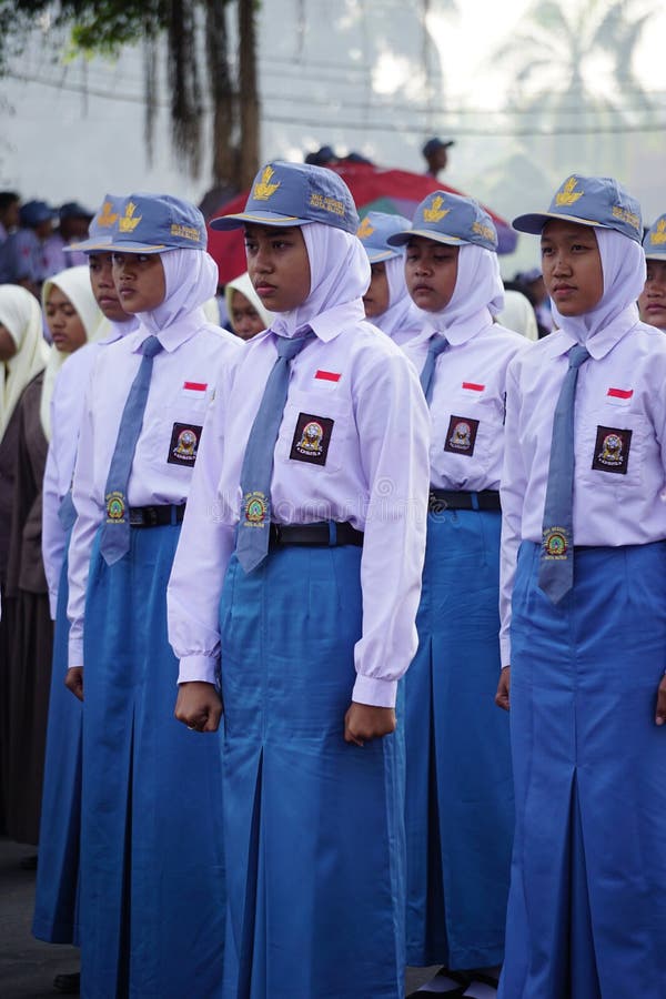 Indonesian Senior High School Students With Uniforms Marching To indonesian-senior-high-school-students-with-uniforms-marching-to