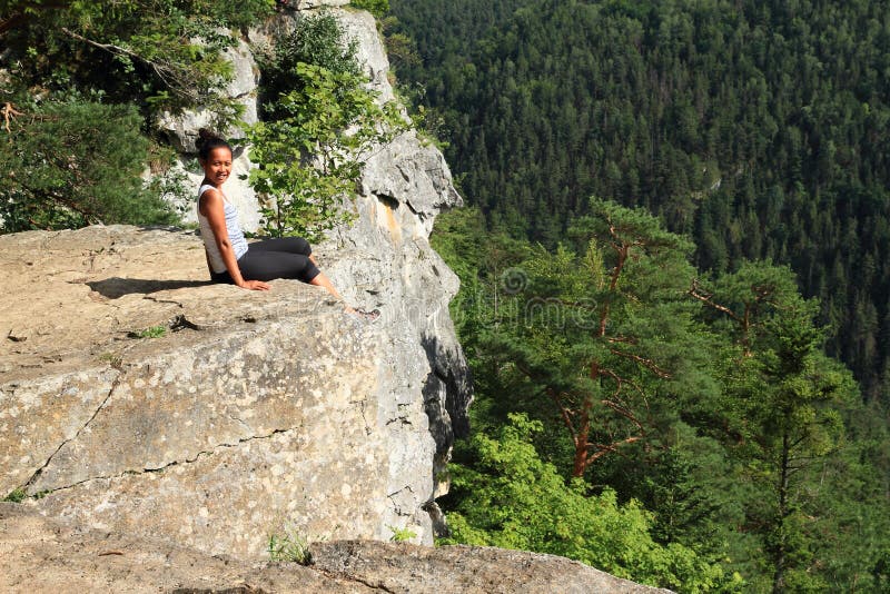 Tourist sitting at the edge of Thomas?s View in Slovak Paradise