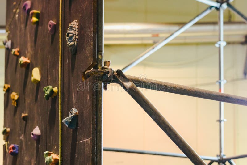 Indoor climbing wall for children during a fair. Female climbing high risk building stock images, royalty-free photos and pictures