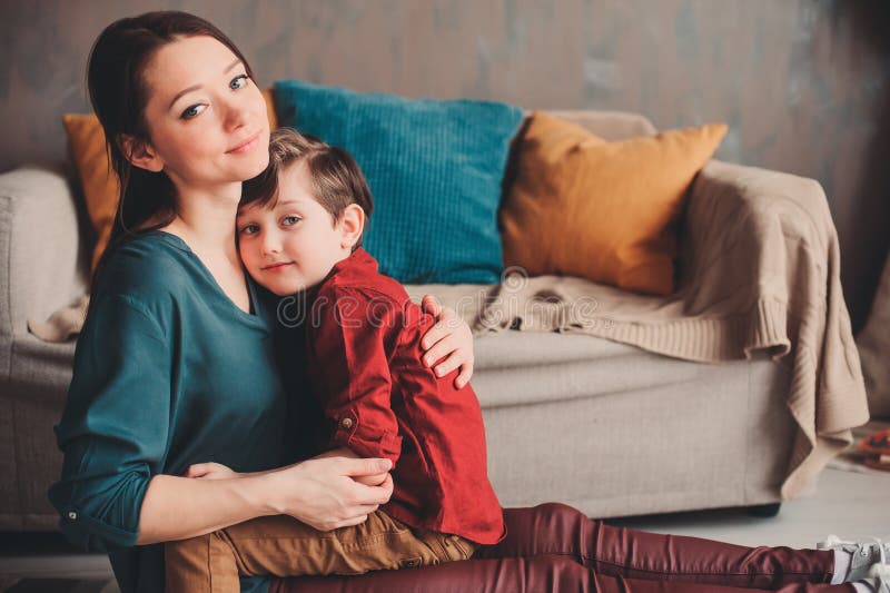 indoor portrait of happy loving mother comforting toddler son at home. stock images indoor portrait of happy loving mother comforting toddler son at home. stock images