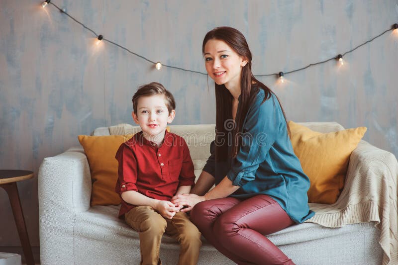 Indoor portrait of happy loving mother comforting toddler son at home. royalty free stock photo Indoor portrait of happy loving mother comforting toddler son at home. royalty free stock photo