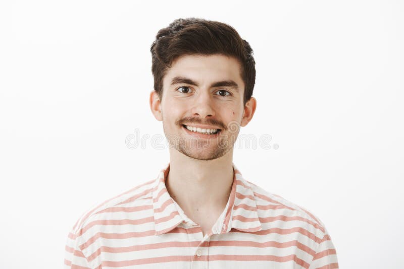 Indoor portrait of pleased handsome ordinary european man with moustache and beard, smiling broadly, feeling confident royalty free stock images Indoor portrait of pleased handsome ordinary european man with moustache and beard, smiling broadly, feeling confident royalty free stock images