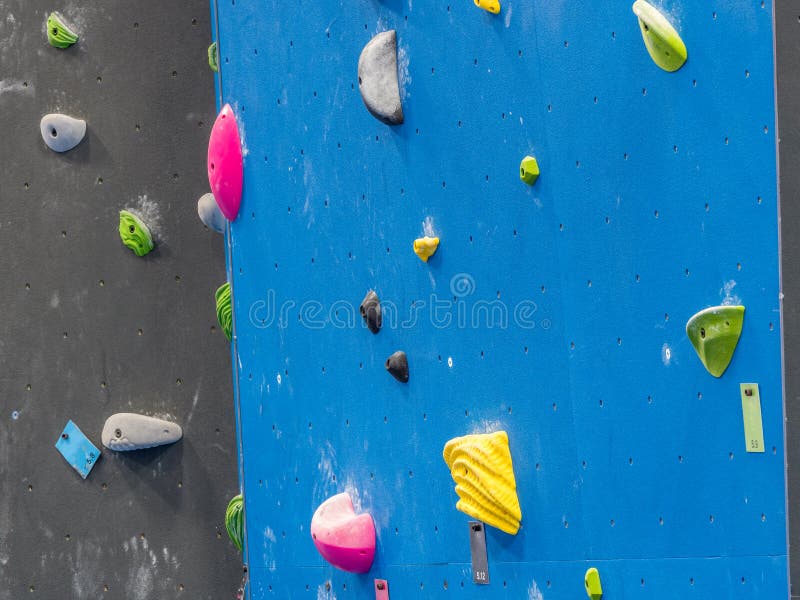 Indoor rock climbing gym stock image. Image of climber 131273343