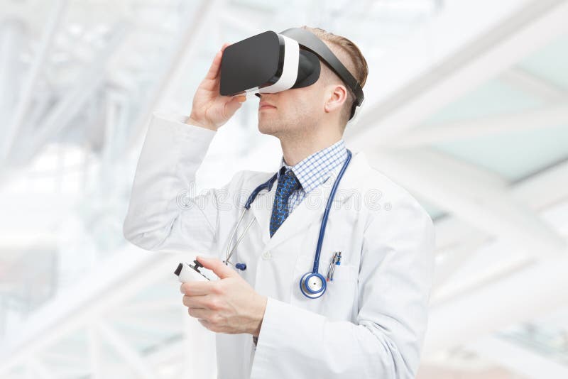 Indoors close up shot of male doctor wearing VR glasses stock photos Indoors close up shot of male doctor wearing VR glasses stock photos