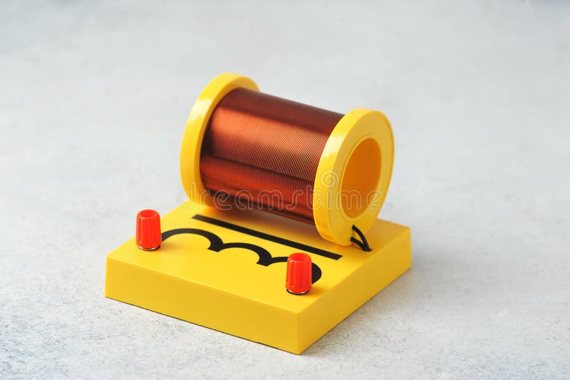 Induction Coil on a Yellow Stand Equipment for a Physics Lesson Stock