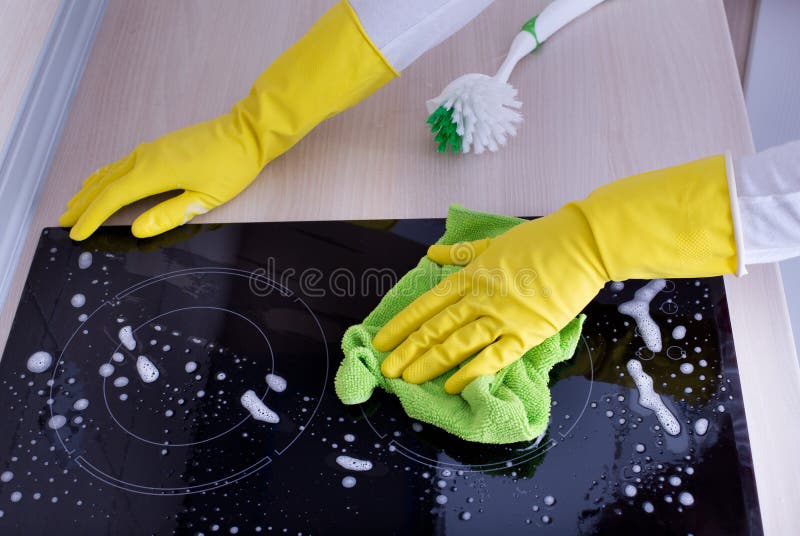 Induction hob cleaning stock image. Image of chores, cleaner 64961273