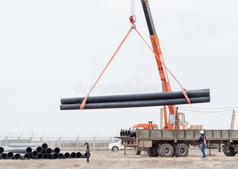 Industrial area. Unloading by the crane of the production equipment.