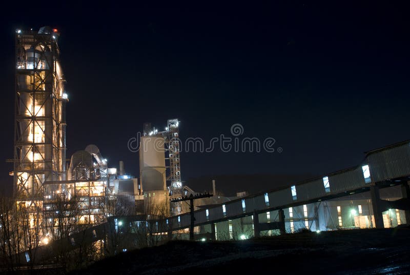 Landscape of industrial building enlightened in the night with black background. Industrial lights stock images, royalty-free photos and pictures