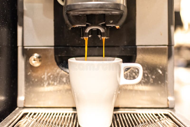 Industrial Coffee Maker Preparing a Coffee with Milk Stock Image