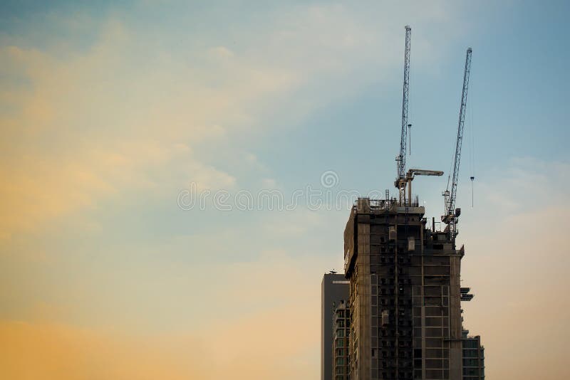 Industrial Construction Building Tower in Sun Set Sky Stock Photo