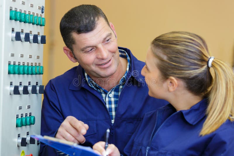 Industrial Electrical Panel Maintenance Worker at Work Stock