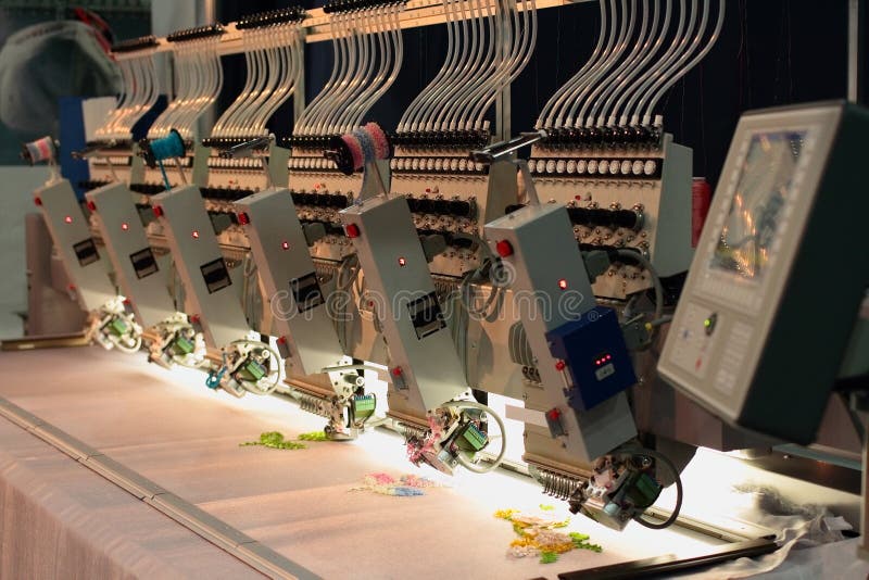 Hat sewing at modern and automatic high technology embroidery machine for  textile - clothing apparel making manufacturing process in industrial Stock  Photo