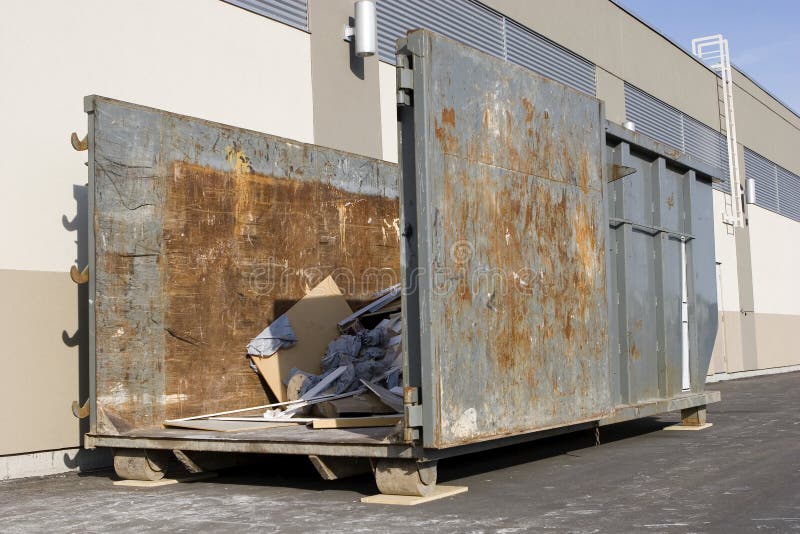 Industrial garbage container on construction site royalty free stock photo
