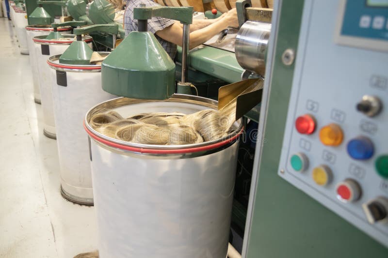 Industrial loom on textile. Flax processing plant, fabric production. Flax is made. A workshop at a textile factory. royalty free stock photo