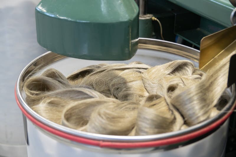 Industrial loom on textile. Flax processing plant, fabric production. Flax is made. A workshop at a textile factory. royalty free stock photos