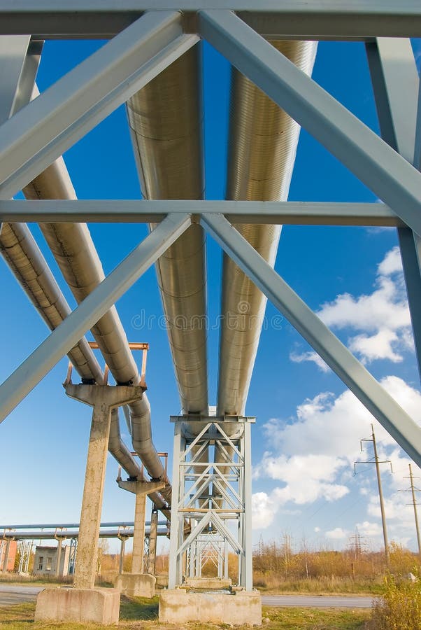 Industrial pipelines against blue sky.