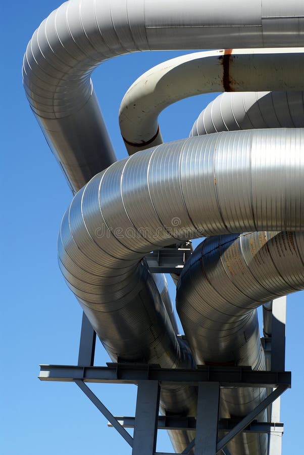 Industrial pipelines on pipe-bridge and blue sky