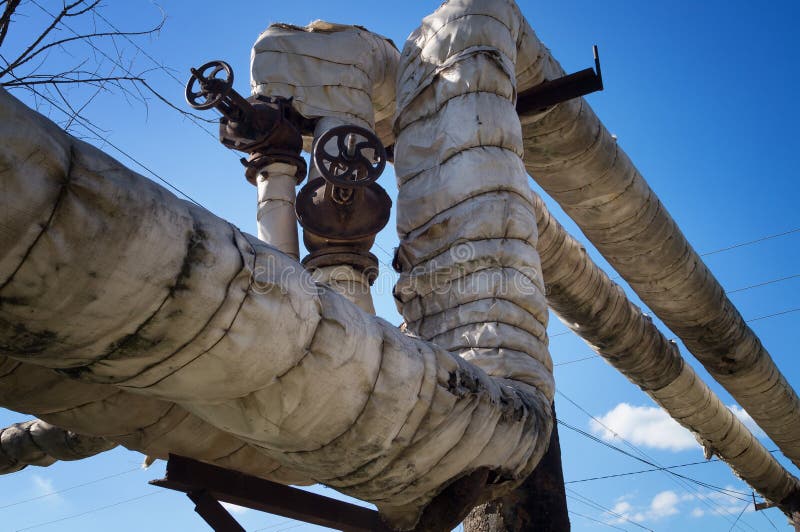 Industrial Pipes in City. Water Supply Valve with a Round Handle Stock